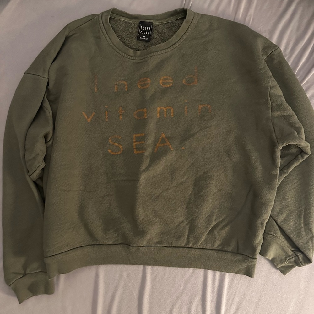 Green Sweatshirt with Gold Text